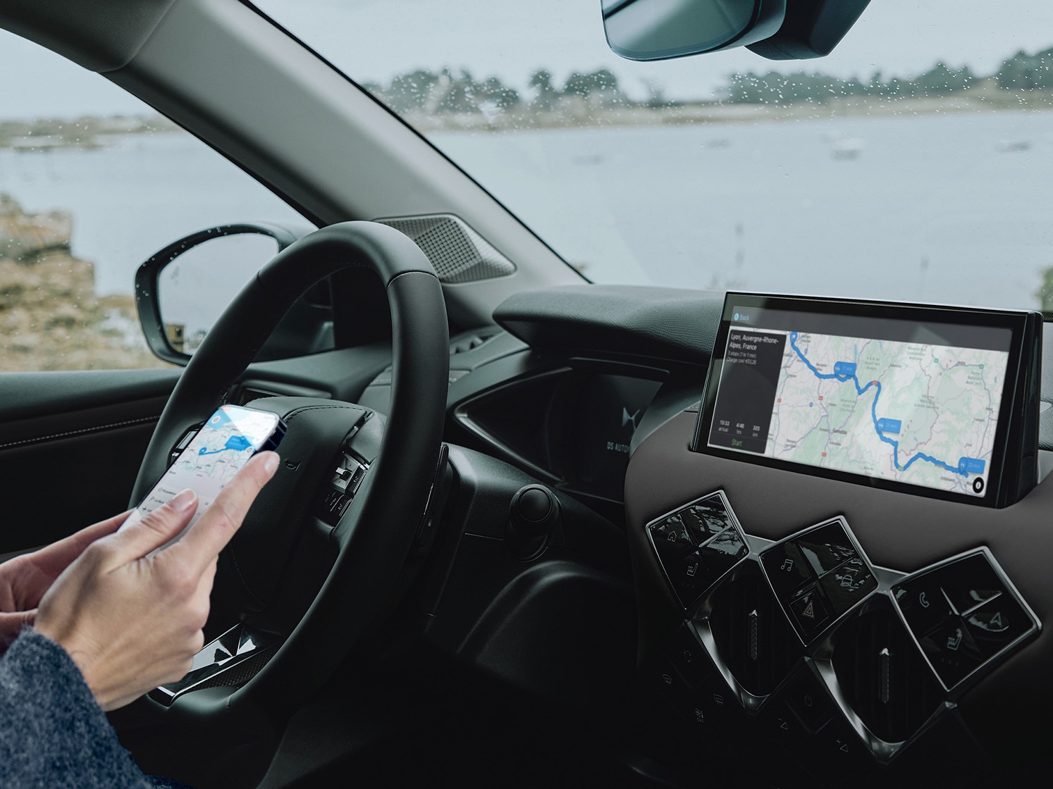 Driver using e-Routes app in DS vehicle