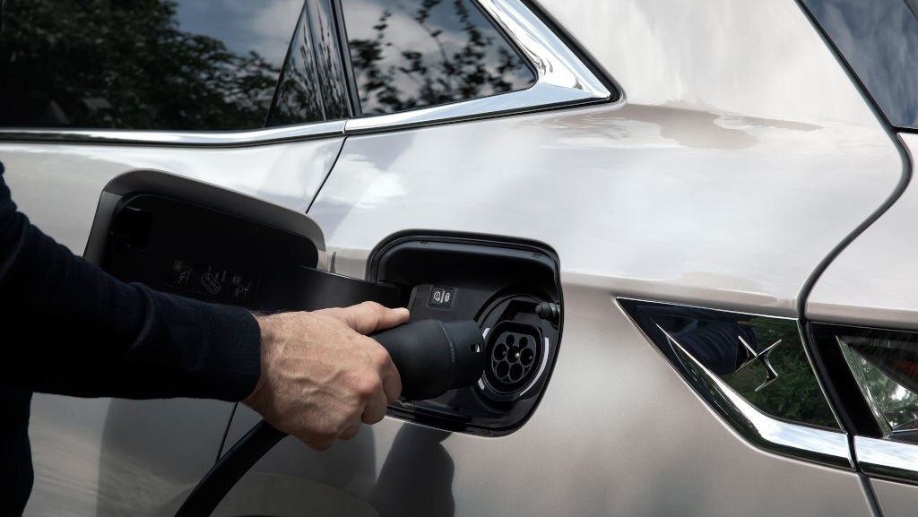 View of DS 7 Crossback E-TENSE having charger connected to it 